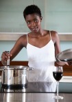 black-woman-cooking-in-the-kitchen-epw2obvq